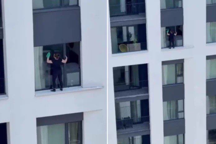 (ВИДЕО) Храброст или лудост: Србинка чисти прозорци на 11 кат, однадвор